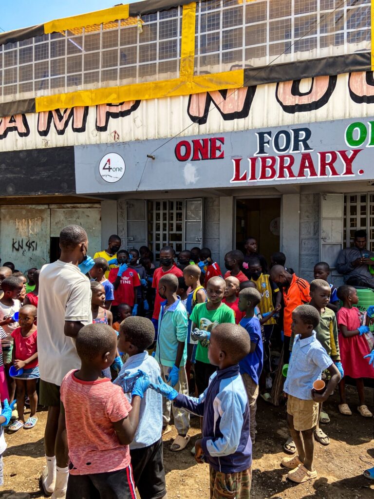 children in front of a library